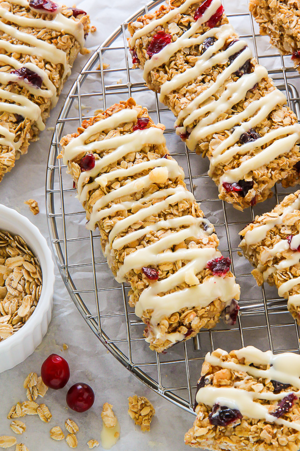 Loaded with cranberries, macadamia nuts, and topped with a sweet drizzle of white chocolate. These homemade granola bars are as easy as they are irresistible!