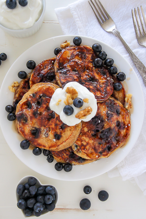 Whole Wheat Greek Yogurt Blueberry Pancakes made in one bowl! Click through for the recipe. Bakerbynature.com