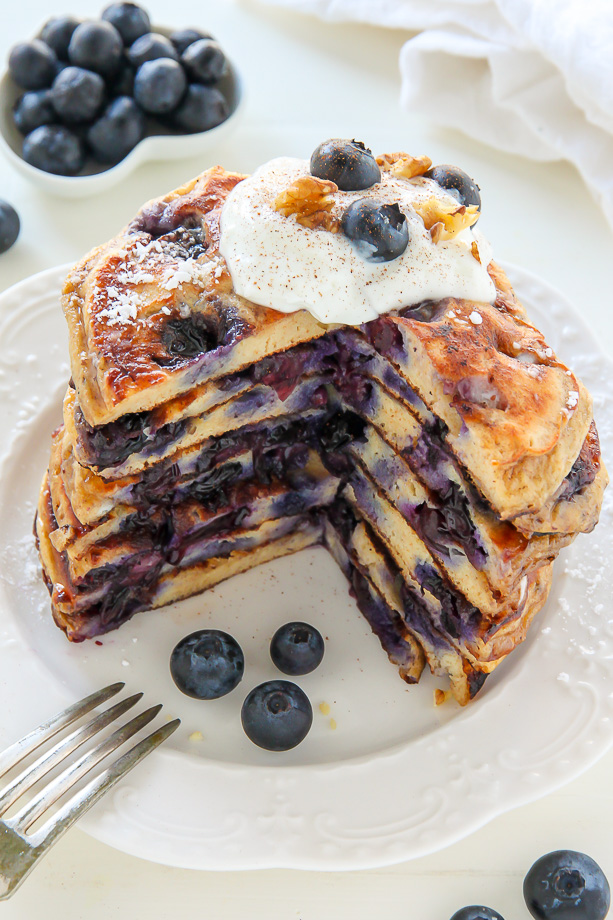 Whole Wheat Greek Yogurt Blueberry Pancakes made in one bowl! Click through for the recipe. Bakerbynature.com