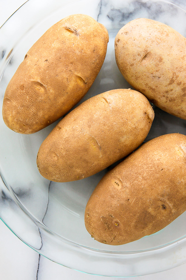 AMAZING FLAVOR! Crispy broccoli and cheddar twice-baked potatoes are comfort food at its best. Click through for the recipe and step-by-step photos.