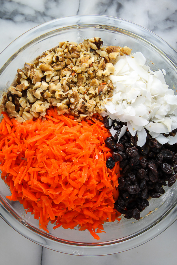 Ingredients for morning glory muffins in a large bowl.