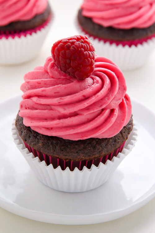 Decadent chocolate cupcakes stuffed with creamy nutella and topped with fresh raspberry frosting.