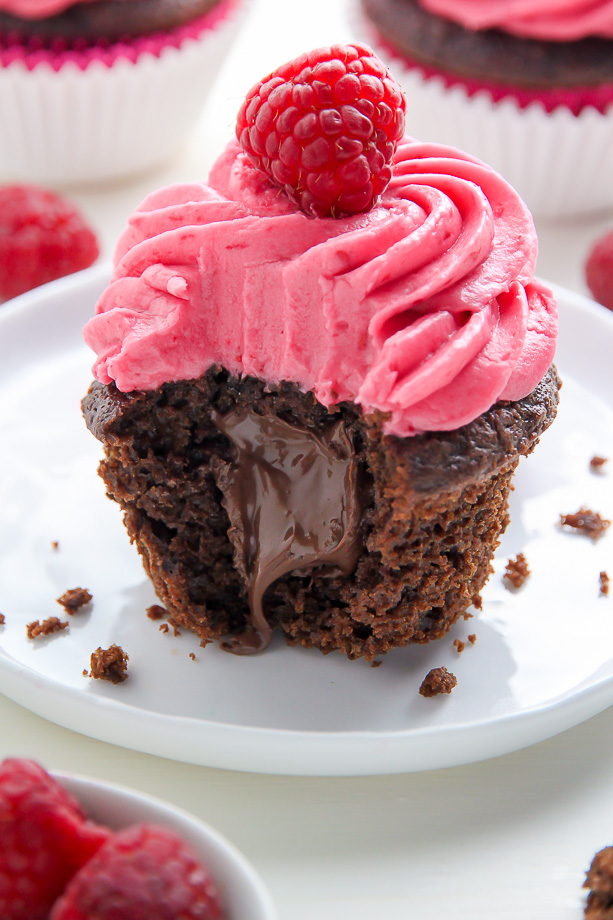 Decadent chocolate cupcakes stuffed with creamy nutella and topped with fresh raspberry frosting.