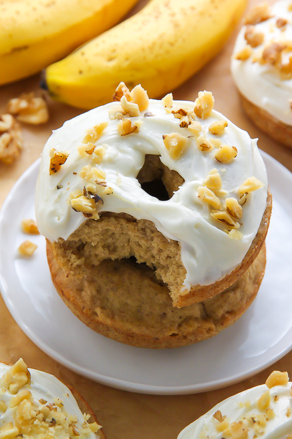 Supremely moist and flavorful banana bread donuts topped with luscious cream cheese frosting! Add a sprinkle of chopped walnuts for a lovely little crunch.