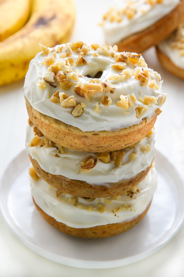 Supremely moist and flavorful banana bread donuts topped with luscious cream cheese frosting! Add a sprinkle of chopped walnuts for a lovely little crunch.