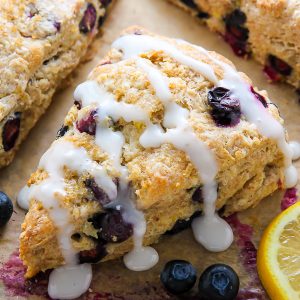 Lightened up Greek yogurt blueberry scones infused with lemon flavor and topped with a sweet lemon glaze. Simply irresistible!