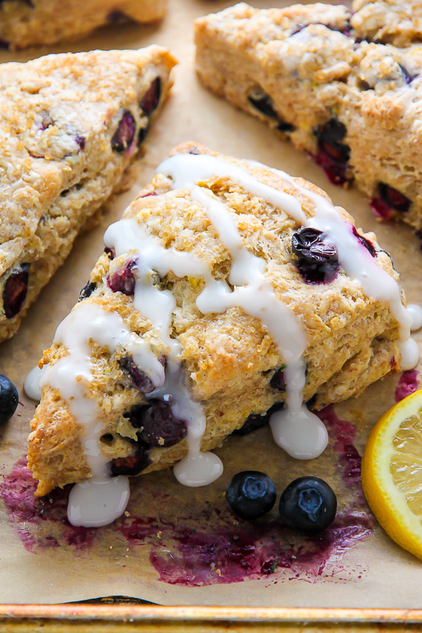 Lightened up Greek yogurt blueberry scones infused with lemon flavor and topped with a sweet lemon glaze. Simply irresistible!