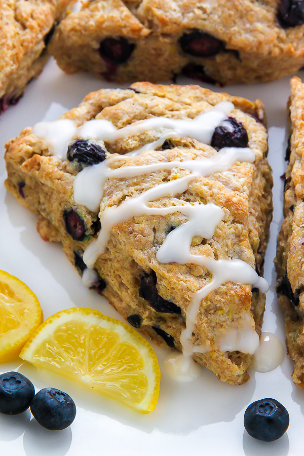 Lightened up Greek yogurt blueberry scones infused with lemon flavor and topped with a sweet lemon glaze. Simply irresistible!