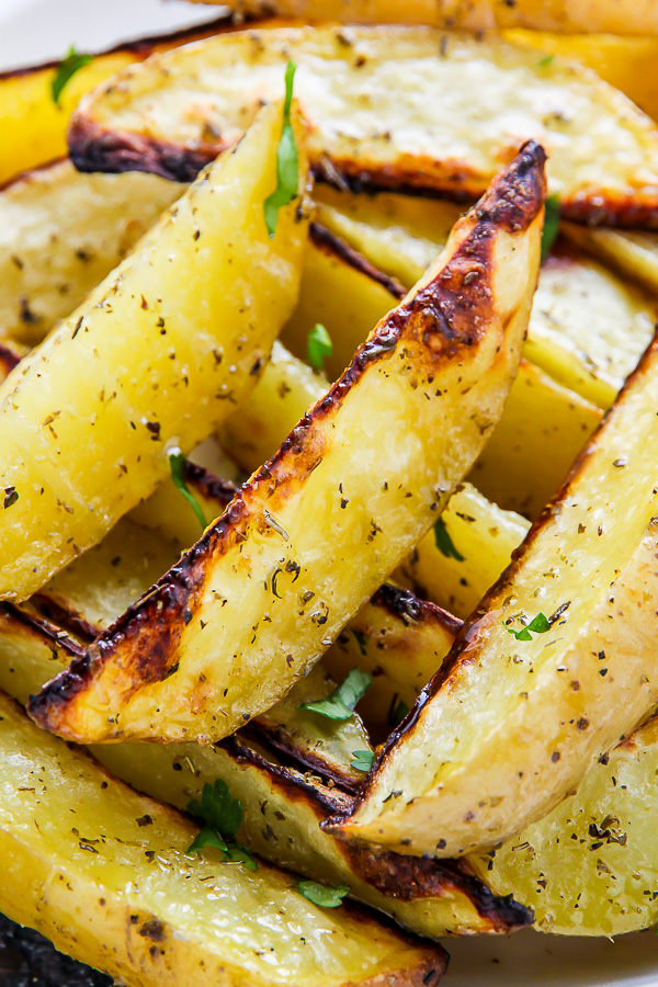 Extra Crispy Baked Garlic & Herb Potato Wedges - Baker by Nature