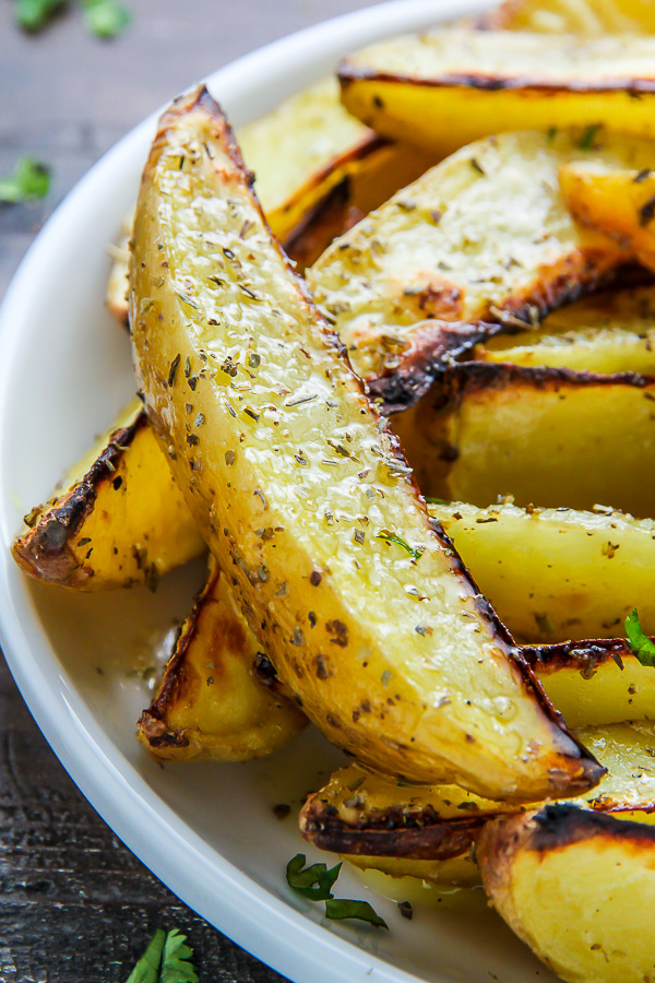 Extra Crispy Baked Garlic & Herb Potato Wedges - Baker by Nature