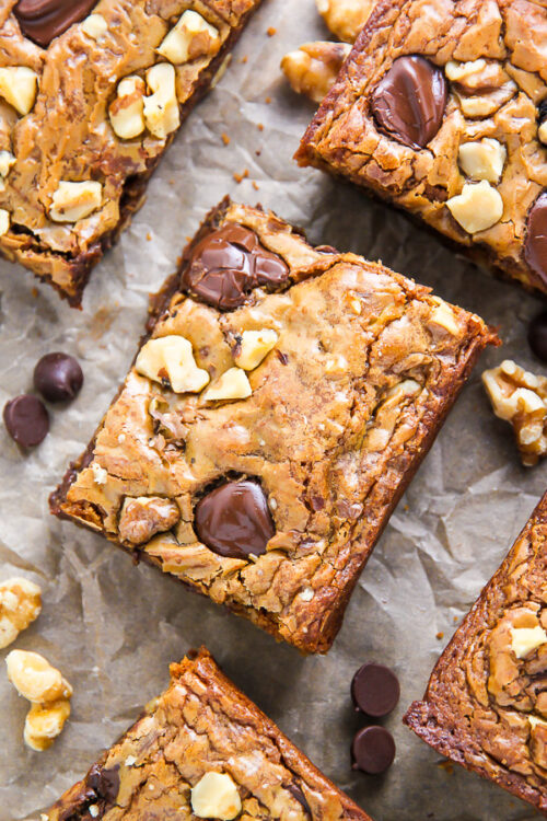 Ultra thick and chewy brown butter blondies loaded with toasted walnuts and plenty of chocolate chips! They're practically begging to be served with a cold glass of milk.