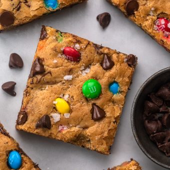 These thick and chewy Brown Butter M&M Blondies are irresistible! An easy cookie bar that's loaded with chocolate chips and M&M candies. Loved by kids and adults, this blondie recipe is always a crowd pleaser! 