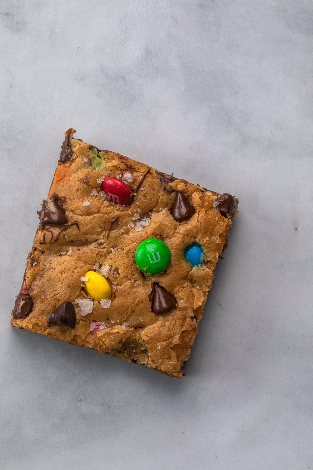 These thick and chewy Brown Butter M&M Blondies are irresistible! An easy cookie bar that's loaded with chocolate chips and M&M candies. Loved by kids and adults, this blondie recipe is always a crowd pleaser! 