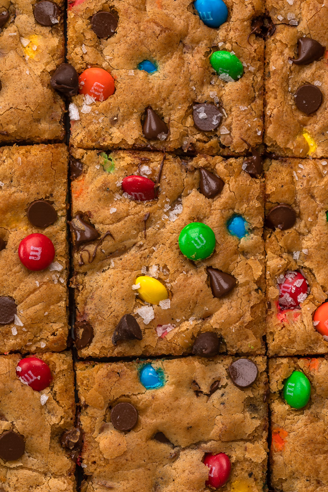 These thick and chewy Brown Butter M&M Blondies are irresistible! An easy cookie bar that's loaded with chocolate chips and M&M candies. Loved by kids and adults, this blondie recipe is always a crowd pleaser! 