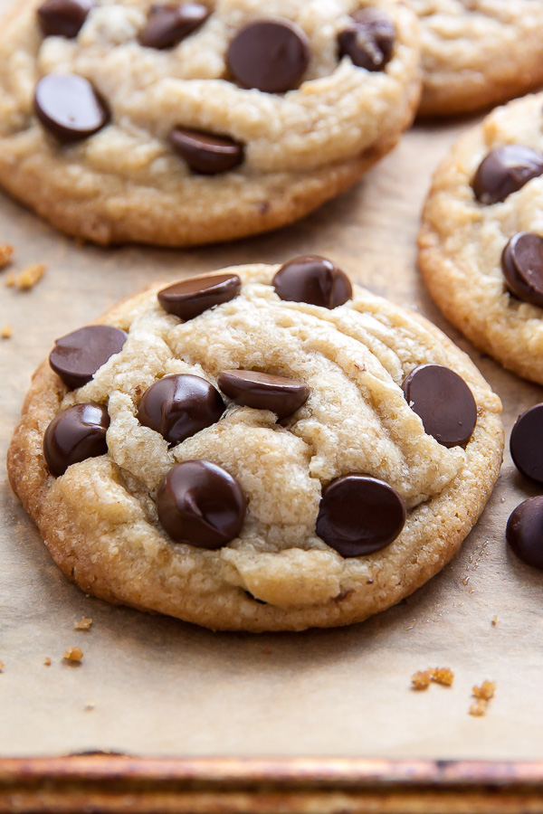 Coconut Oil Chocolate Chip Cookies with soft centers and crispy edges! The best part? No cookie dough chilling required! Just roll and bake.