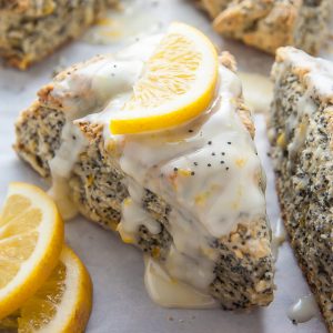 Classic and crumbly Meyer Lemon Poppy Seed Scones. The sunshine sweet lemon glaze makes them irresistible!