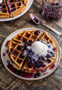 Greek Yogurt Blueberry Waffles with Fresh Blueberry Sauce - Baker by Nature