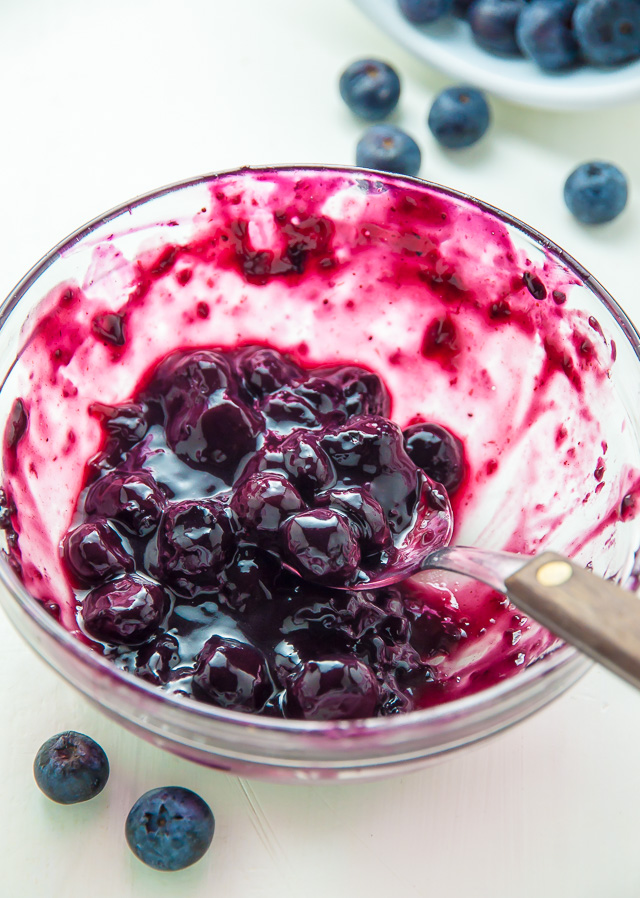 Homemade Greek Yogurt Blueberry Waffles topped with fresh blueberry sauce. Fluffy, crispy, phenomenal.