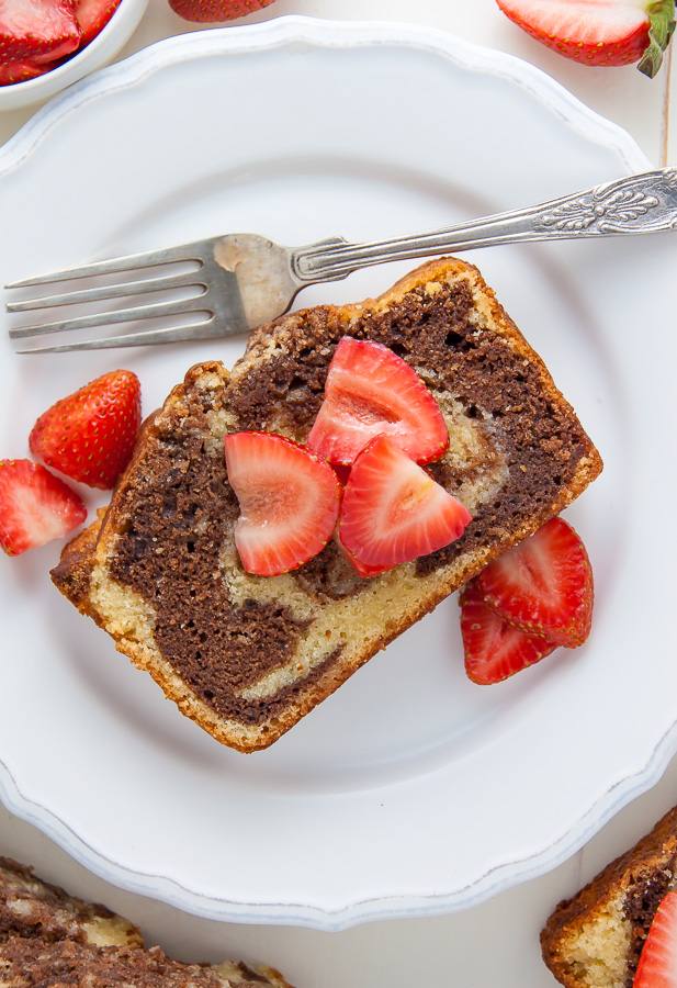 Supremely Moist Marble Pound Cake topped with juicy strawberries! This one's a keeper.