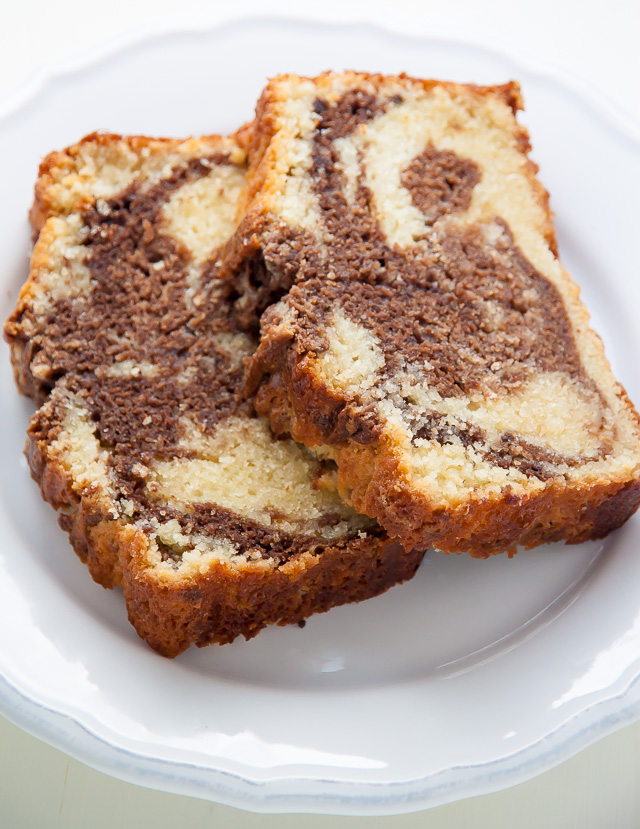 Supremely Moist Marble Pound Cake topped with juicy strawberries! This one's a keeper.