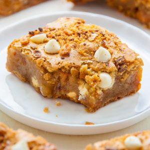 Chewy Butterfinger Blondies loaded with White Chocolate Chips! Easy, delicious, incredible.