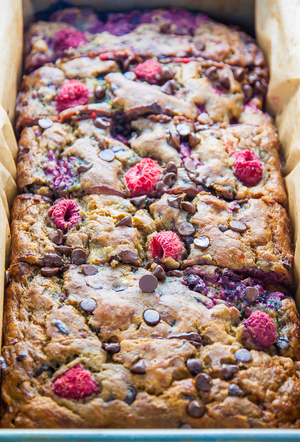 Supremely moist Banana Bread studded with fresh raspberries and chocolate chips. Bonus: It's healthy!