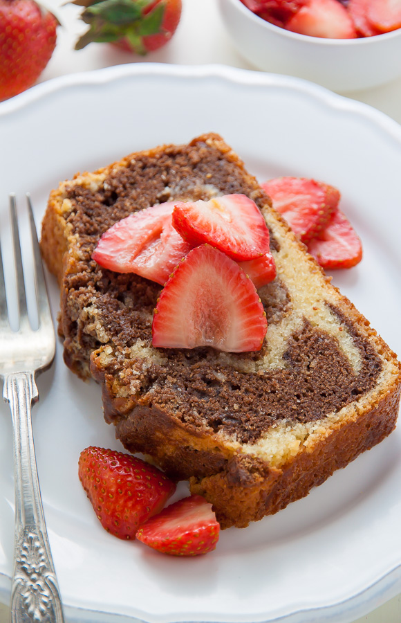 Supremely Moist Marble Pound Cake topped with juicy strawberries! This one's a keeper.