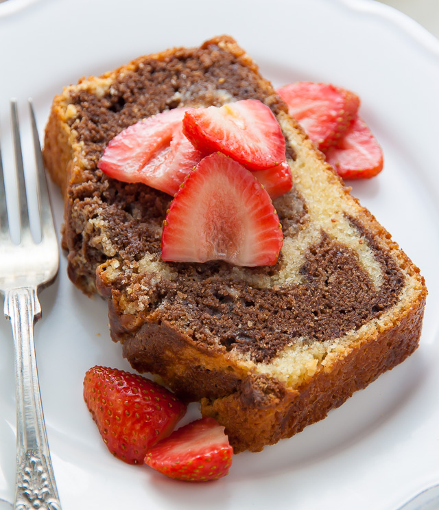 Supremely Moist Marble Pound Cake topped with juicy strawberries! This one's a keeper.