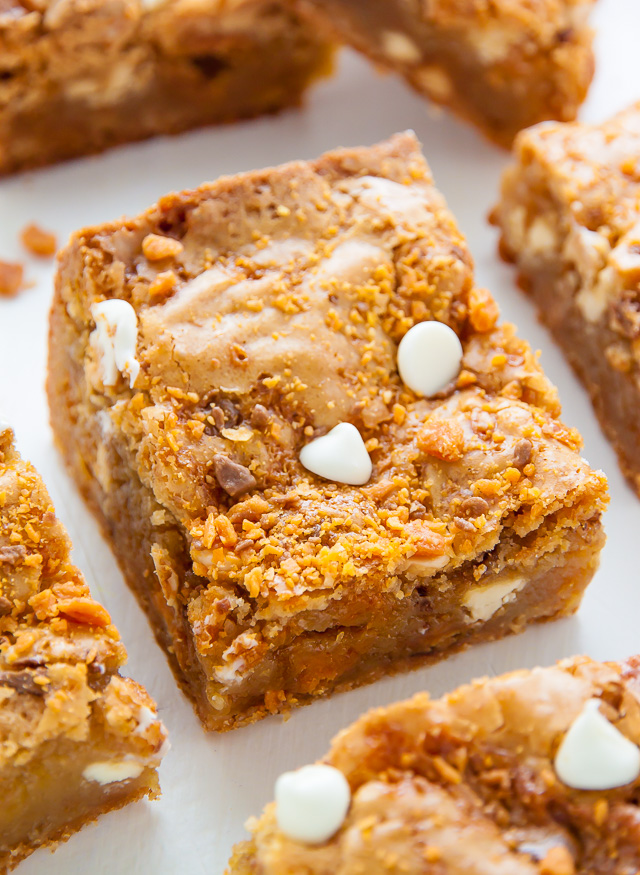 Chewy Butterfinger Blondies loaded with White Chocolate Chips! Easy, delicious, incredible.