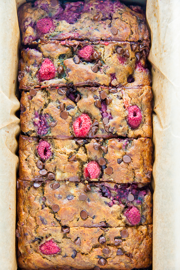 Supremely moist Banana Bread studded with fresh raspberries and chocolate chips. Bonus: It's healthy!