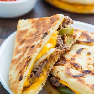 Philly Cheesesteak Quesadillas are loaded with meat, cheese, pepper, and onions! Serve with marinara sauce, ketchup, or sour cream.