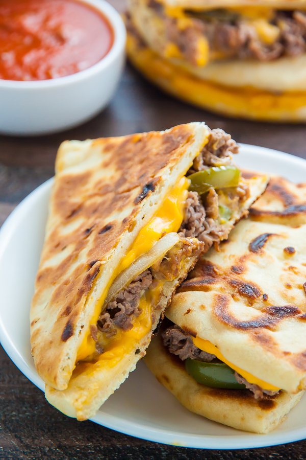 Philly Cheesesteak Quesadillas are loaded with meat, cheese, pepper, and onions! Serve with marinara sauce, ketchup, or sour cream.