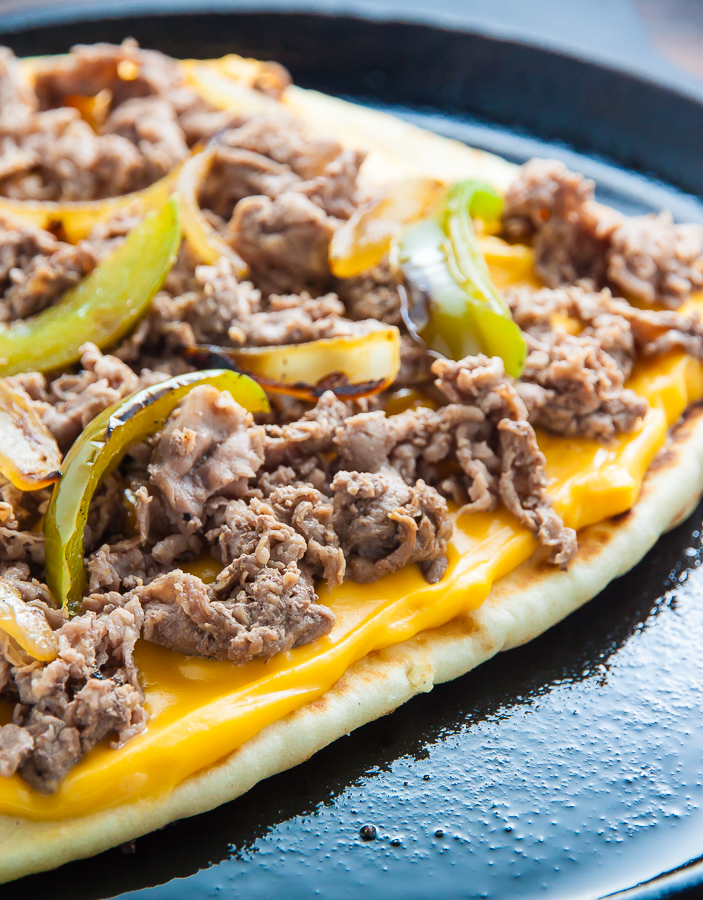 Philly Cheesesteak Quesadillas are loaded with meat, cheese, pepper, and onions! Serve with marinara sauce, ketchup, or sour cream. 
