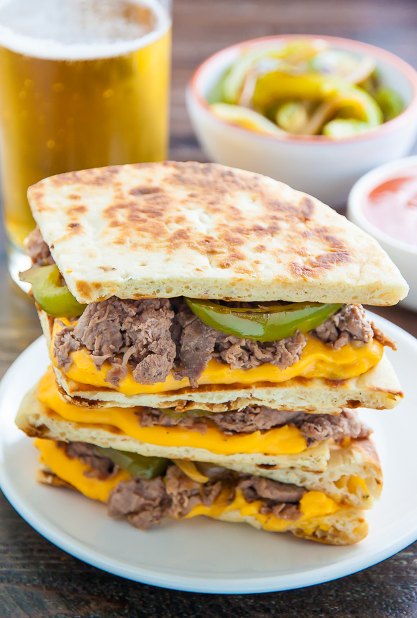 Philly Cheesesteak Quesadillas are loaded with meat, cheese, pepper, and onions! Serve with marinara sauce, ketchup, or sour cream.