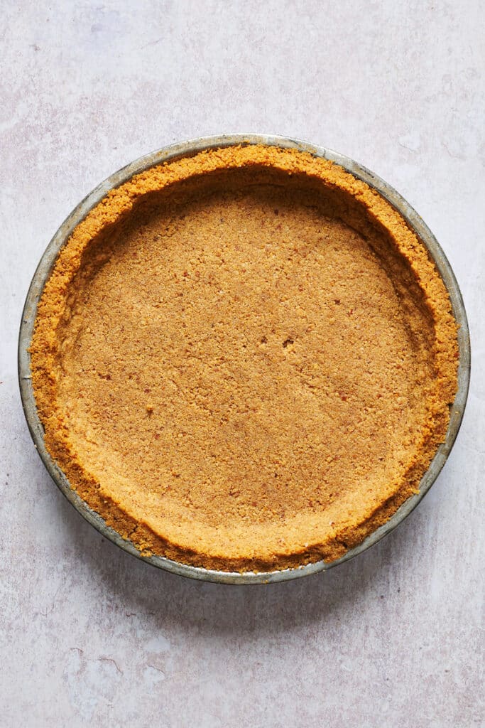 Golden brown graham cracker crust for coconut cream pie recipe.