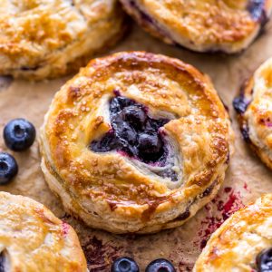 Mini Blueberry Pie on baking sheet.