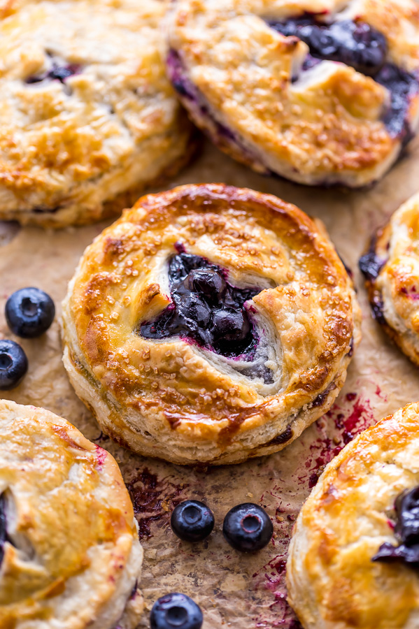 Mini Blueberry Pie on baking sheet.