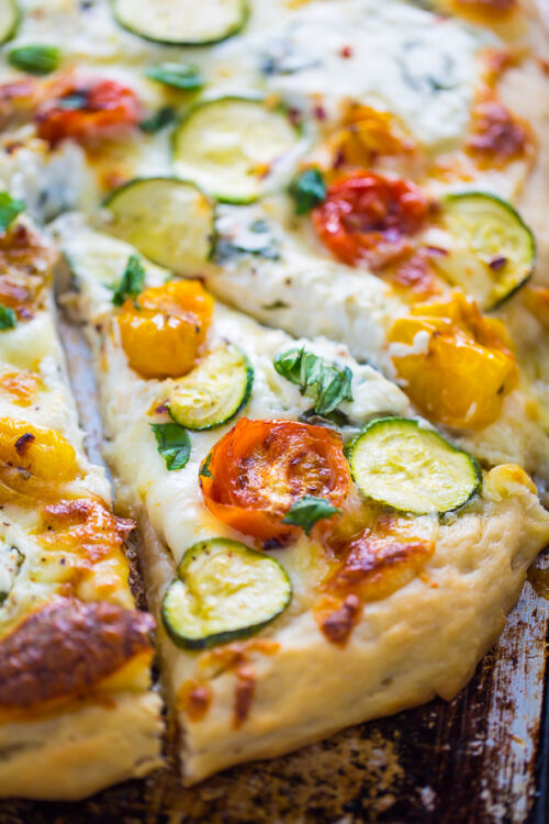 My favorite White Pizza with tomatoes, basil, and zucchini! AKA the PERFECT Summer meal.