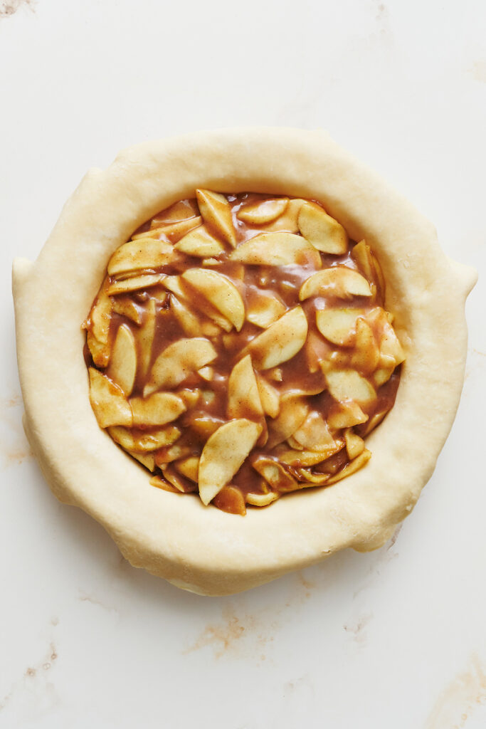 Gooey apple pie filling inside an all butter pie crust.