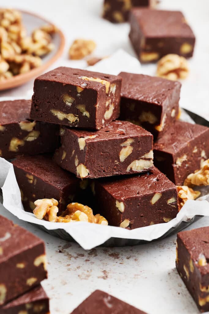 Plate of chocolate fudge with walnuts.