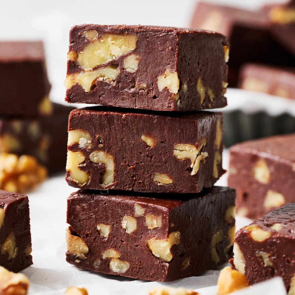 Stack of chocolate fudge with walnuts.