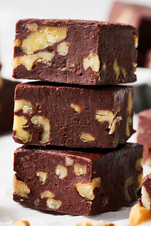 Stack of chocolate fudge with walnuts.