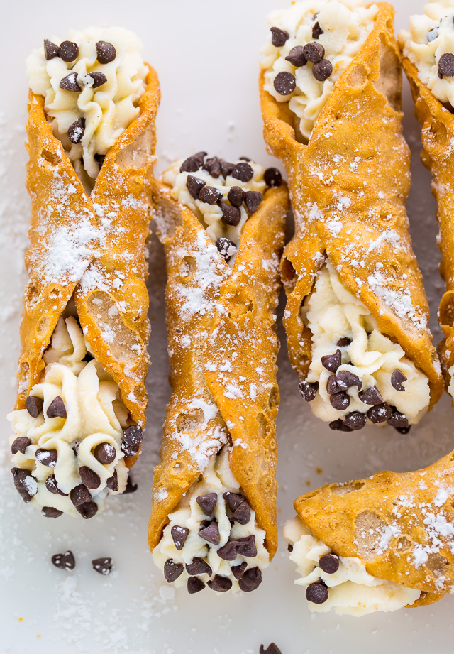 Cannoli shells with cannoli filling and mini chocolate chips.