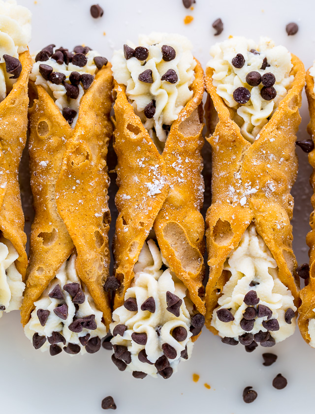 Cannoli shells with cannoli filling and mini chocolate chips.