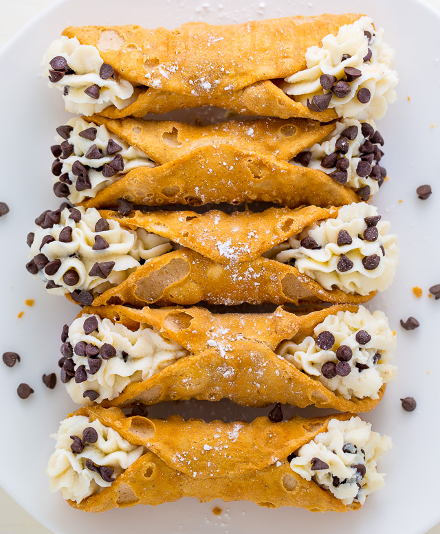 Cannoli shells with cannoli filling and mini chocolate chips.