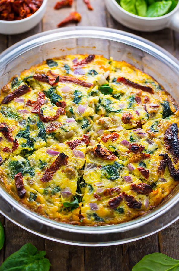 Easy and delicious, this healthier Crustless Quiche with Spinach, Sausage, and Sundried Tomatoes is perfect for brunch or dinner!