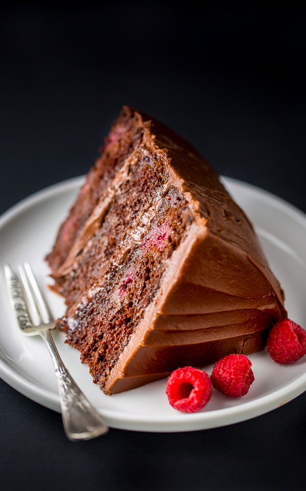 This Triple Layer Chocolate Raspberry Cake is a SHOWSTOPPER! Top with fresh raspberries for an extra lovely presentation.