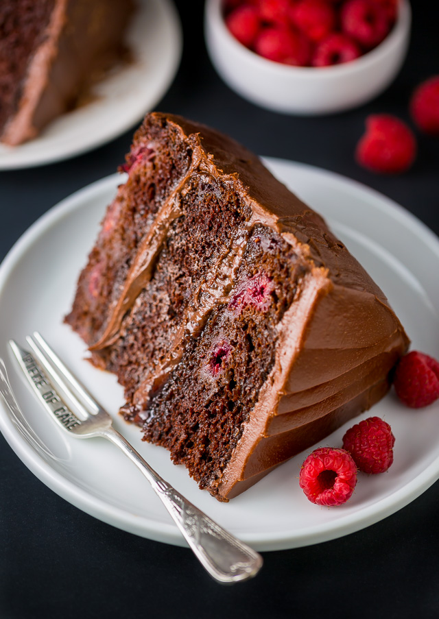 This Triple Layer Chocolate Raspberry Cake is a SHOWSTOPPER! Top with fresh raspberries for an extra lovely presentation.