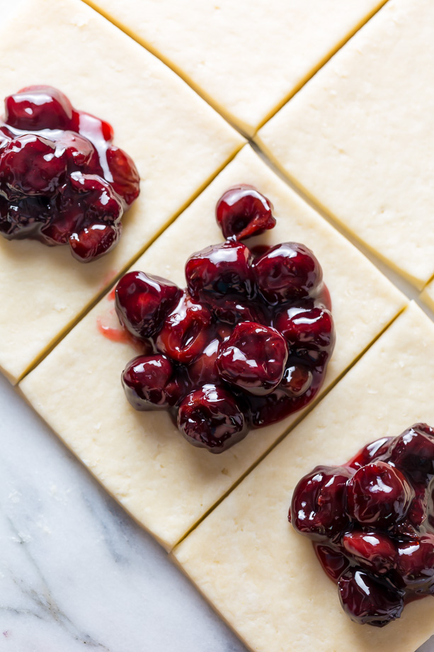 Homemade Cherry Hand Pies have flaky crust and juicy filling!