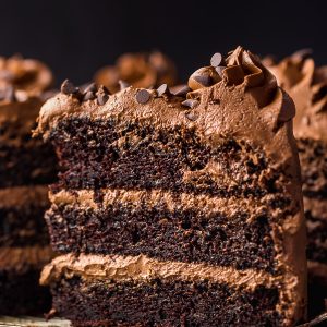 Chocolate zucchini cake on wire cooling rack.